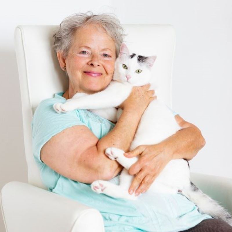 A client holding her cat
